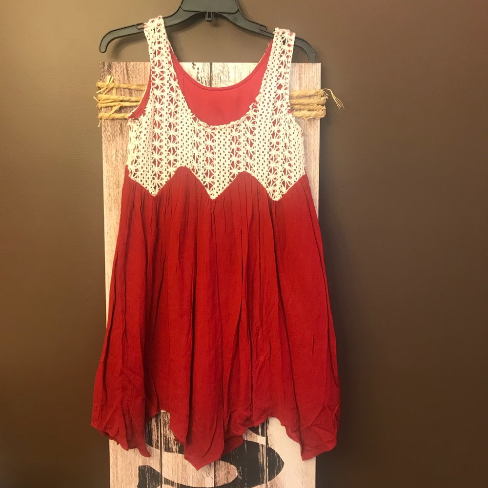 Crimson and white sleeveless dress.